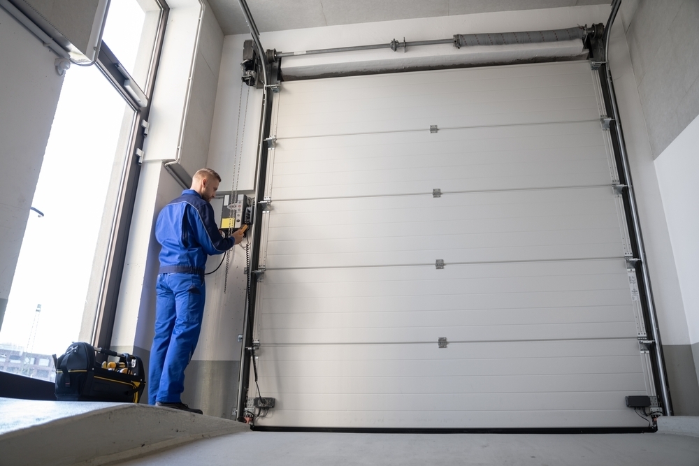 Comment remplacer une porte de garage basculante par une porte sectionnelle ?