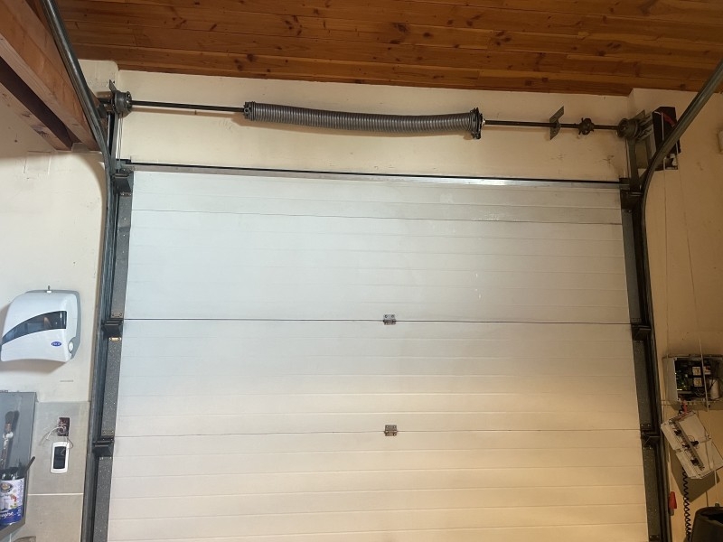 Comment changer ressort porte de garage basculante ?
