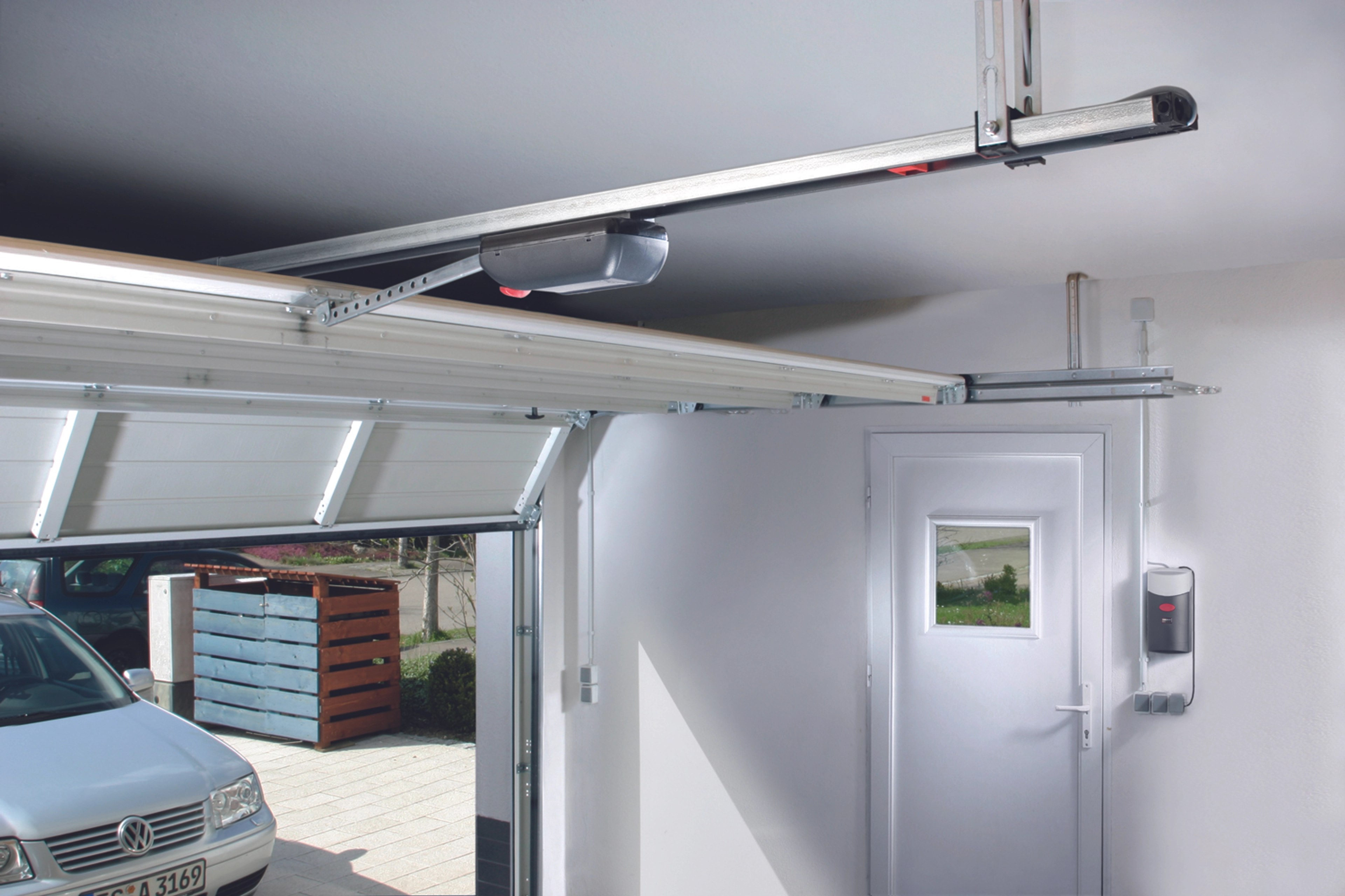 Comment remplacer une porte de garage basculante par une porte sectionnelle ?